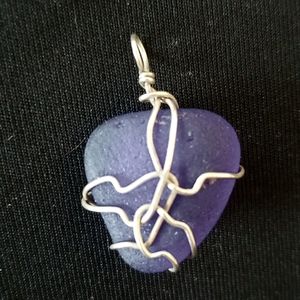 Silver wire wrapped blue heart shaped sea glass pendant
